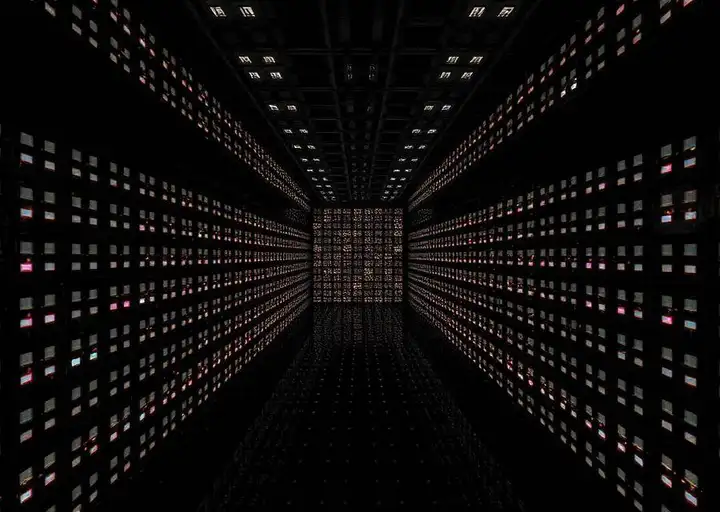 An infinite grid of glowing tiny boxes inside a dark server room